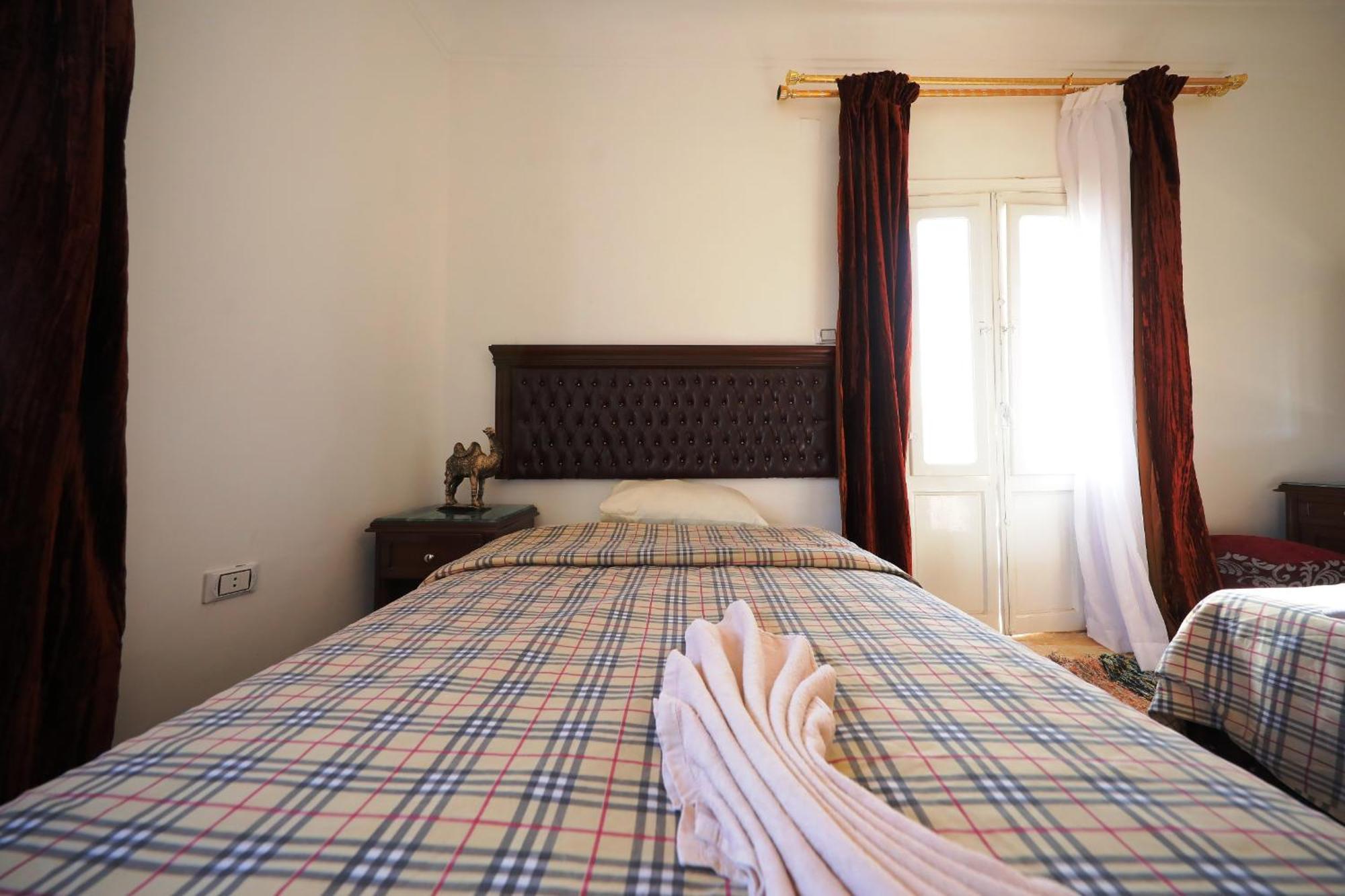 Pyramids Loft Guesthouse Cairo Quarto foto